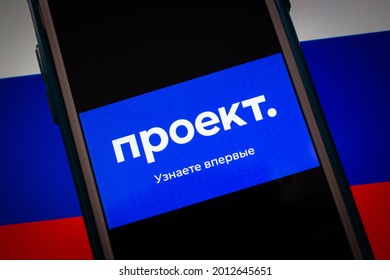 Kumamoto, JAPAN - Jul 19 2021 : Closeup logo of Proekt Media, an independent Russian media specializing in investigative journalism, in its website on iPhone on Russian Flag background