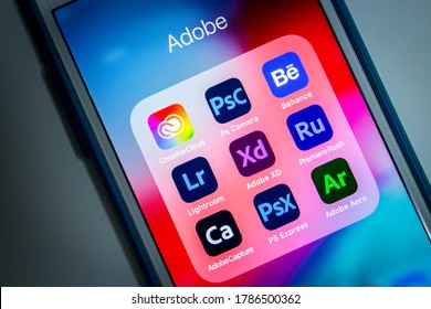 Kumamoto, Japan - Jul 29 2020 : Adobe Creative Cloud & other Adobe apps (Ps Camera, Behance, Lightroom, XD, Premiere Rush, Capture, PS Express & Aero) on iPhone screen.