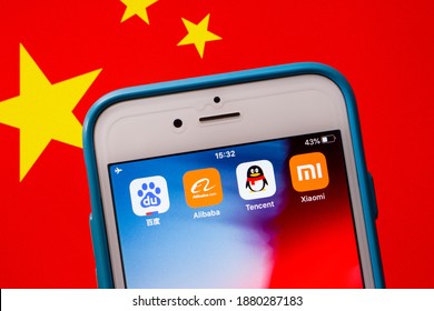 Kumamoto, JAPAN - Oct 2 2020 : BATX China’s Big Tech (Baidu, Alibaba, Tencent And Xiaomi) On IPhone With Chinese Flag. BATX Is Counter-standing By GAFA (Google, Amazon, Facebook And Apple) In US