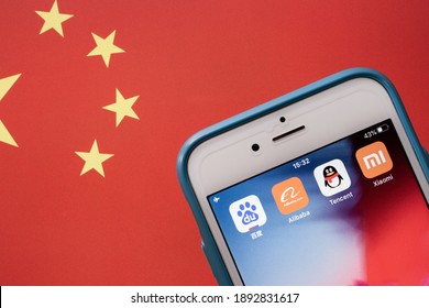 Kumamoto, JAPAN - Oct 2 2020 : BATX China’s Big Tech (Baidu, Alibaba, Tencent And Xiaomi) On IPhone With Chinese Flag. BATX Is Counter-standing By GAFA (Google, Amazon, Facebook And Apple) In US