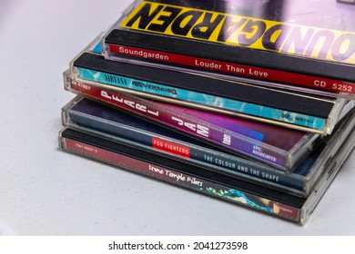 Kumamoto, JAPAN - Sep 1 2021 : Conceptual popular US Alternative, Grunge Rock and Punk Albums (Soundgarden, Nirvana, Pearl Jam, Foo Fighters and Stone Temple Pilots) in 1990’s on the table.