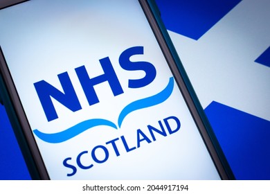 Kumamoto, JAPAN - Sep 6 2021 : Closeup Logo NHS Scotland, The Publicly Funded Healthcare System In Scotland, On IPhone On Scottish Flag In Dark Mood. It Is The One Of The National Health Service In UK