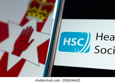 Kumamoto, JAPAN - Sep 6 2021 : Closeup Health And Social Care (HSC), The Publicly Funded Healthcare System In Northern Ireland Created Separately To The NHS In UK, On IPhone On Northern Ireland Flag