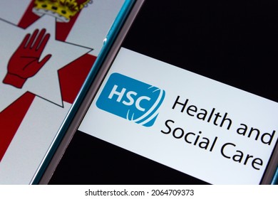 Kumamoto, JAPAN - Sep 6 2021 : Closeup Health And Social Care (HSC), The Publicly Funded Healthcare System In Northern Ireland Created Separately To The NHS In UK, On IPhone On Northern Ireland Flag