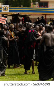 KUMASI, GHANA - JAN 16, 2017: Unidentified Ghanaian People In Black Clothes At The Memorial Ceremony Dedicated To The Queen Mother Of The Asante Kingdom