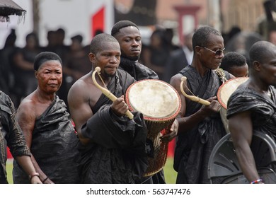 KUMASI, GHANA - JAN 16, 2017: Unidentified Ghanaian People In Black Clothes At The Memorial Ceremony Dedicated To The Queen Mother Of The Asante Kingdom