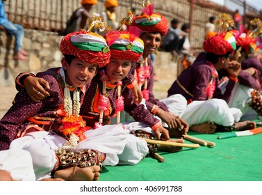 KUMBHALGARH, INDIA - JANUARY 28, 2014: Young indian men in traditional costumes wait  their turn to dance at the open festival of traditional Rajasthan culture, Kumbhalgarh, India