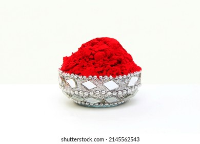 kumkum powder in silver bowl use for indian traditional god worship and applying a bindi(mark) on forehead of woman for good luck on white background - Shutterstock ID 2145562543