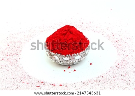 kumkum powder in silver bowl use for indian traditional god worship and applying a bindi(mark) on forehead of woman for good luck in circle random dots on white background Stock photo © 