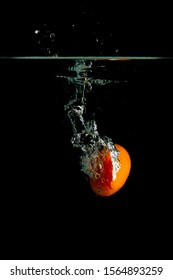 Kumquat Falls Under Water With Splash