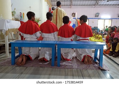 KUMROKHALI, INDIA - FEBRUARY 23, 2020: Altar servers at Mass at Our Lady of Lourdes Church in Kumrokhali, West Bengal, India
