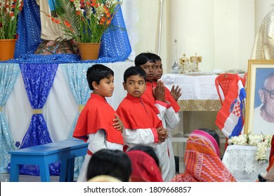 KUMROKHALI, INDIA - FEBRUARY 23, 2020: Altar servers at Mass at Our Lady of Lourdes Church in Kumrokhali, West Bengal, India