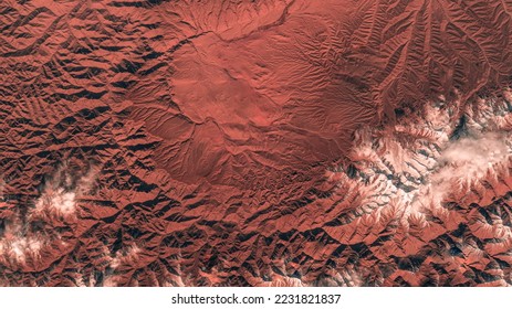 Kunlun Mountains in China. Earth landscape background. Aerial view of mountain scenery. Natural patterns on earth background. Elements of this image furnished by NASA - Powered by Shutterstock