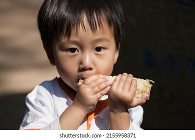 KUNMING, CHINA - APR 13 :  Unidentified Kid take a photo at The Golden Temple Park, is a Taoist bronze-tiled temple in the country located on the Mingfeng Mountains on Apr 13, 2009