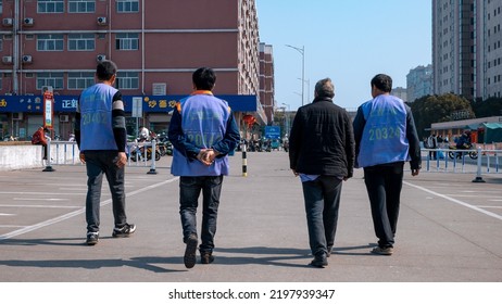 KUNSHAN, CHINA - May 18, 2021: A Back View Of A Group Of Taiwan Electronics Factory Workers In A Blue Uniform