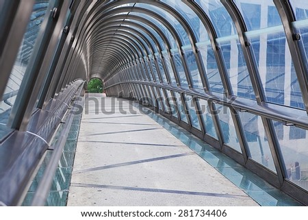 Kupka Bridge covered by roof made of chrome and glass in La Defense business district, Paris, France