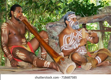 KURANDA, AUSTRALIA - NOVEMBER 07, 2007: Unidentified aborigine actors perform music with traditional instruments in the Tjapukai Culture Park in Kuranda, Queensland, Australia.