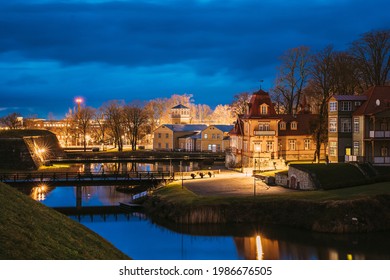 Kuressaare, Estonia. Old Wooden Mansion Ekesparre Boutique Hotel In Wooden Art Nouveau In Evening Blue Hour Night.