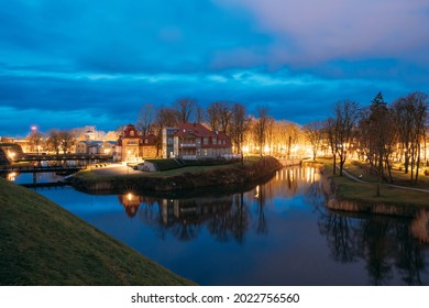 Kuressaare, Estonia. Old Wooden Mansion Ekesparre Boutique Hotel In Wooden Art Nouveau In Evening Blue Hour Night.