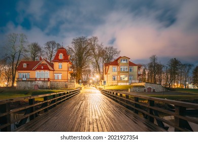 Kuressaare, Estonia. Old Wooden Nobleman's House And Mansion Ekesparre Boutique Hotel In Wooden Art Nouveau In Evening Blue Hour Night.