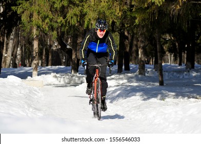 Kurgan / Russia - March 5 2017: Cyclist Rides In The Winter Park.