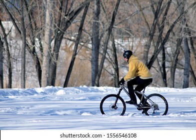 Kurgan / Russia - March 5 2017: Cyclist Rides In The Winter Park.