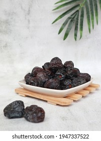 Kurma Ajwa or Ajwa date palm is a type of date from the Middle East which is usually eaten when breaking the fast in the month of Ramadan. The taste is sweet and soft. Selective focus. 