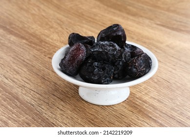 Kurma Ajwa, Ajwa Dates, served in small plate. Kurma Ajwa is one of the special fruit of Arabic.
