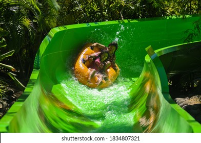 Kuta,Bali Province, Indonesia - May, 2014 : happy family , having fun on vacation on a slide at a water park. Waterbom Bali is the island’s premier waterpark, which has games for all ages