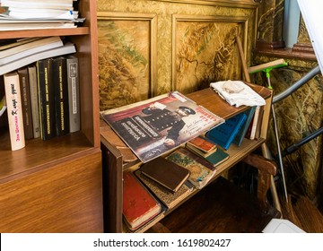 Kutaisi, Georgia, October 13, 2019 : A bookcase stands by the wall in the hall of the old synagogue on the Boris Gaponov street in the old part of Kutaisi in Georgia, in the morning sun