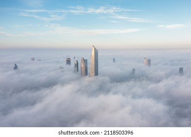Kuwait City - JANUARY 13, 2022: Main City building covered with fog early morning