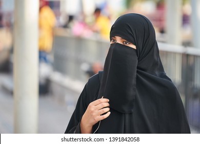 KUWAIT CITY/KUWAIT - April 12, 2019: Portrait of a middle eastern young woman wearing a black niqab.