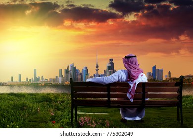 Kuwaiti Man Looking At The Beautiful Kuwait City Landscape During Susnet