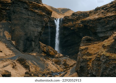 Kvernufoss Waterfall is a hidden gem located in the southern region of Iceland. Peaceful and secluded spot to visit. The waterfall cascades down a rocky cliff into a tranquil pool below - Powered by Shutterstock