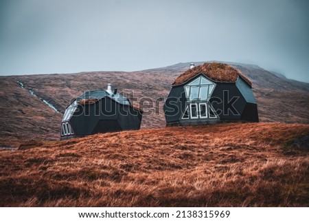 Kvivik Streymoy Faroe Islands, Denmark, Europe november 2021: Weird houses - two tiny geometric igloo homes with grass roofs on the hills. Most original houses and eco friendly in the world
