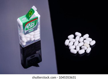 KWIDZYN, POLAND – MARCH 12, 2018: Tic tacs isolated on dark background. Tic tacs are manufactured by Italian confectioner Ferrero and were first produced in 1968.