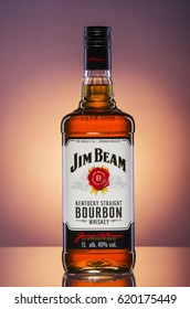 KWIDZYN, POLAND – MARCH 30, 2017: Jim Beam bourbon whiskey on gradient background. Jim Beam is owned by Beam Global Spirits and wine and it has been destiled in Clermont, Kentucky USA since 1795