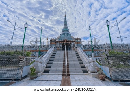 Kyauksein Pagoda, also known as the Jade Pagoda, stands resplendent in Amarapura, Mandalay, adorned with intricate jade decorations under a dramatic sky