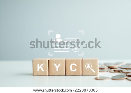 KYC on wooden cubes. know your customer with magnifying glass and customer information. Business verifying the identity of its clients concept.