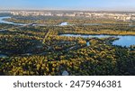 Kyiv city skyline and Dnipro river aerial drone view from above, Kiev hills, pedestrian Park bridge and Dnieper river cityscape in autumn, Ukraine