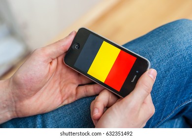 Kyiv - February11: Male Hand Holding IPhone With Belgium Flag On The Display. Ukraine, February11,2017. 