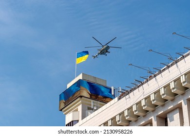 KYIV, KIEV, UKRAINE - August 24, 2021: Military aviation concept. Air Force of Ukraine. A Ukrainian MI-8 helicopter flies over the flag of Ukraine on the 30th Independence Day at a military parade.