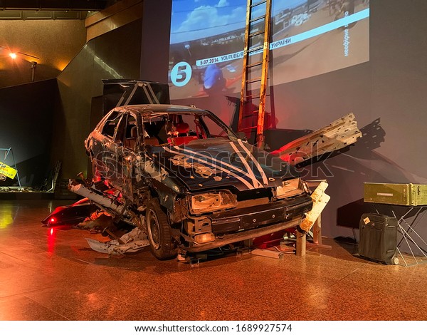 Kyiv, Kyiv/Ukraine - 03.12.2019:\
Crushed car, part of ATO Exhibition in National Museum of History\
of Ukraine in World War II. Soft focus. Editorial use\
only