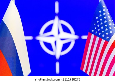 Kyiv, UA – 01.24.2022: The US flag, the Russian flag and NATO flag with copy space for text. Flag of USA and Russia. The USA and the Russian Federation confrontation. Russia's invasion of Ukraine