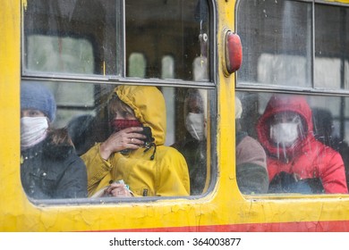 KYIV, UKRAINE - 02.11.2009. Flu Epidemic. Passengers Travel In Transport, Covering Her Face With Protective Gauze Bandages.