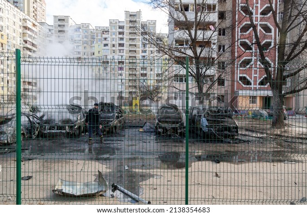 Kyiv, Ukraine – 02.27.2022: Burned cars as a\
result of the bombing of Kiev. Russian military aggression against\
Ukraine. Missile strike on residential district of Kyiv. Shelling\
of civilians.