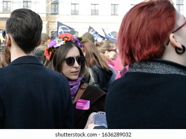 Kyiv, Ukraine, 03/08/2019: Beautiful Woman With The Flowers On Her Head Protesting At The Women's March 2019