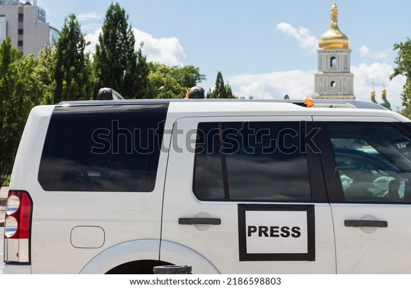 Kyiv, Ukraine - 06.14.2022: Mass media auto with
sign Press in Kyiv, Ukraine. Global journalism. Documentary footage
in Ukraine. News vehicle on the street in centre of Kyiv. Media
symbol on car.