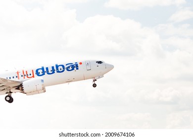 Kyiv, Ukraine - 10 JUL 2021: Front of the aircraft of the Flydubai airline at the time of takeoff on the sky. Day sunny. 