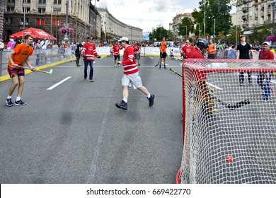 KYIV, UKRAINE - 25 JUNE, 2017: Celebration 150-th anniversary of Canada .  USA and Canada  teams from coworker of organizations plays hockey on street Khreschatick; Ball in Goal